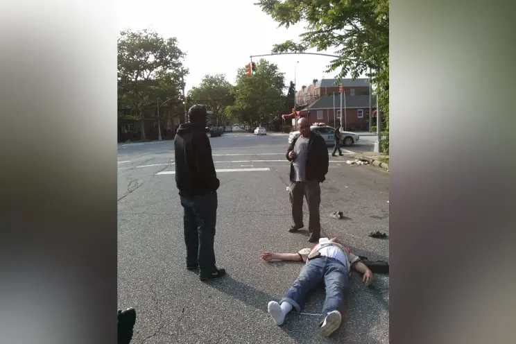 Idris Mojeed (left to right), Noel Lawrence, and Charles Puccio on the ground