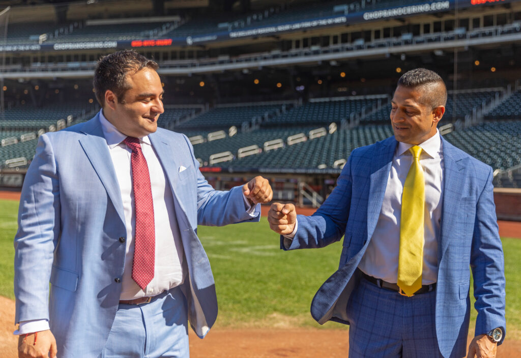 New York accident attorneys, Alex Nocerino and Sameer Chopra fist bumping