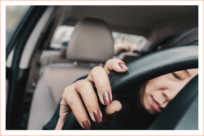 lady sleeping on the steering