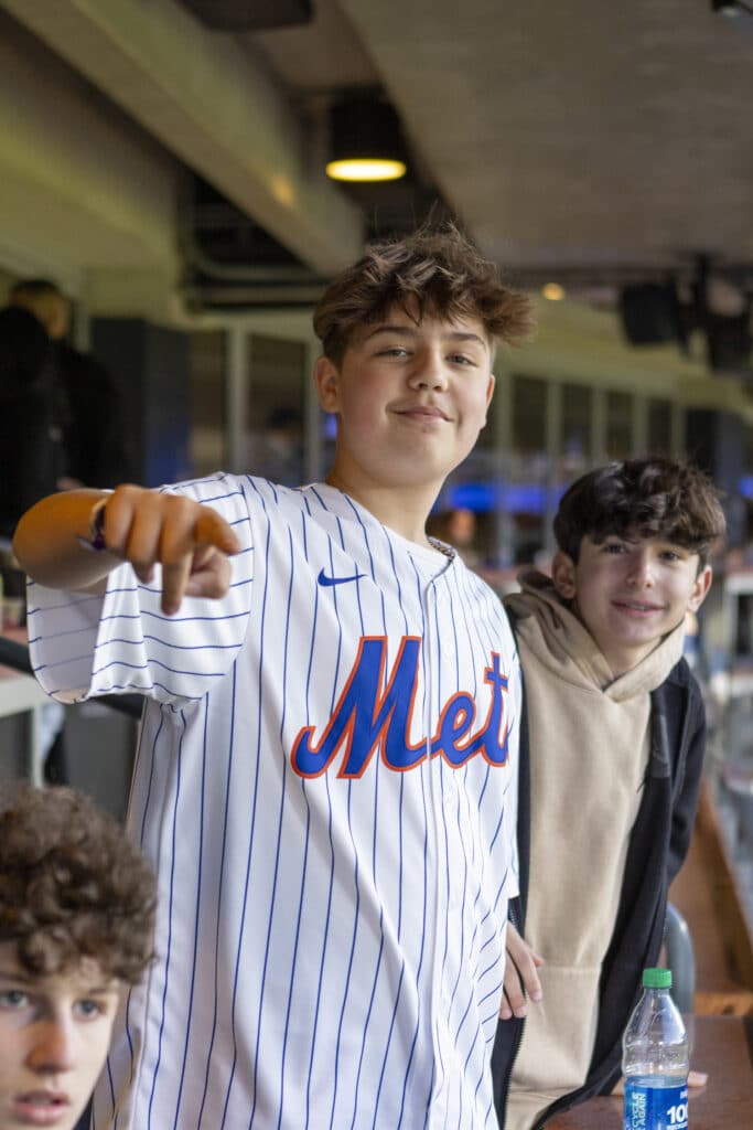 Kids of Chopra & Nocerino's team members posed at New York Mets game