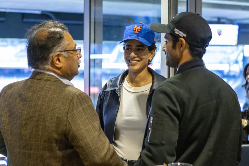 Chopra & Nocerino family members talking at New York Mets game