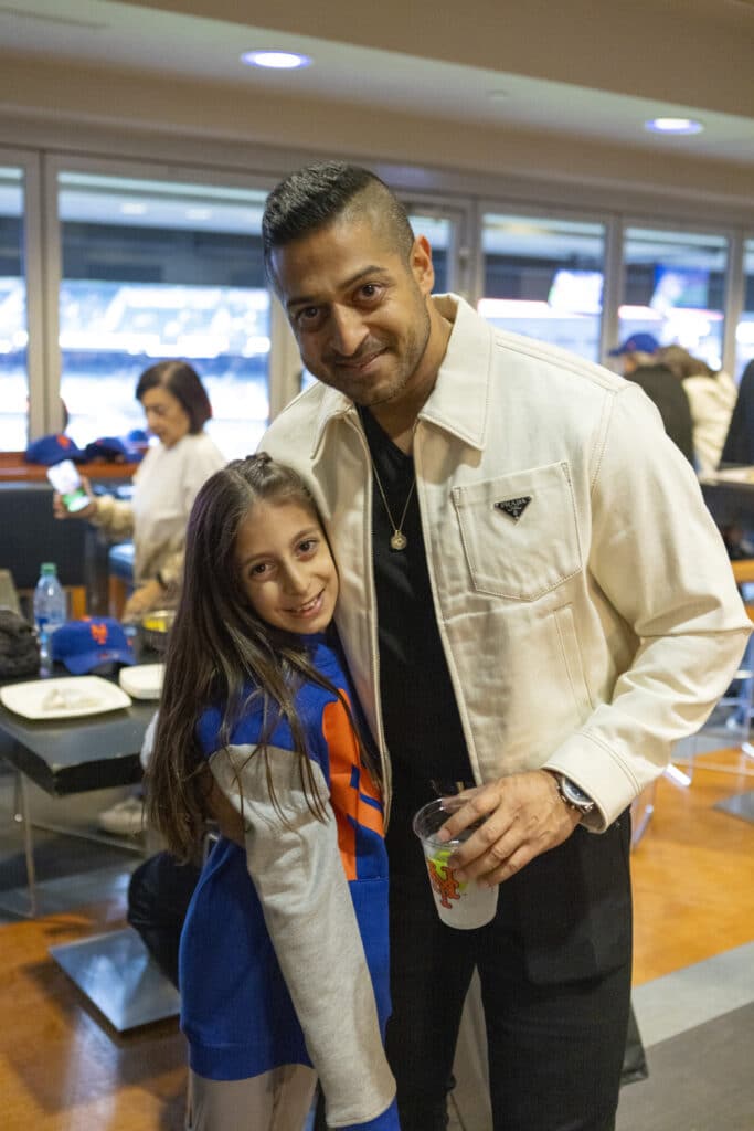 Sameer Chopra posed with daughter in New York Mets gear at baseball game