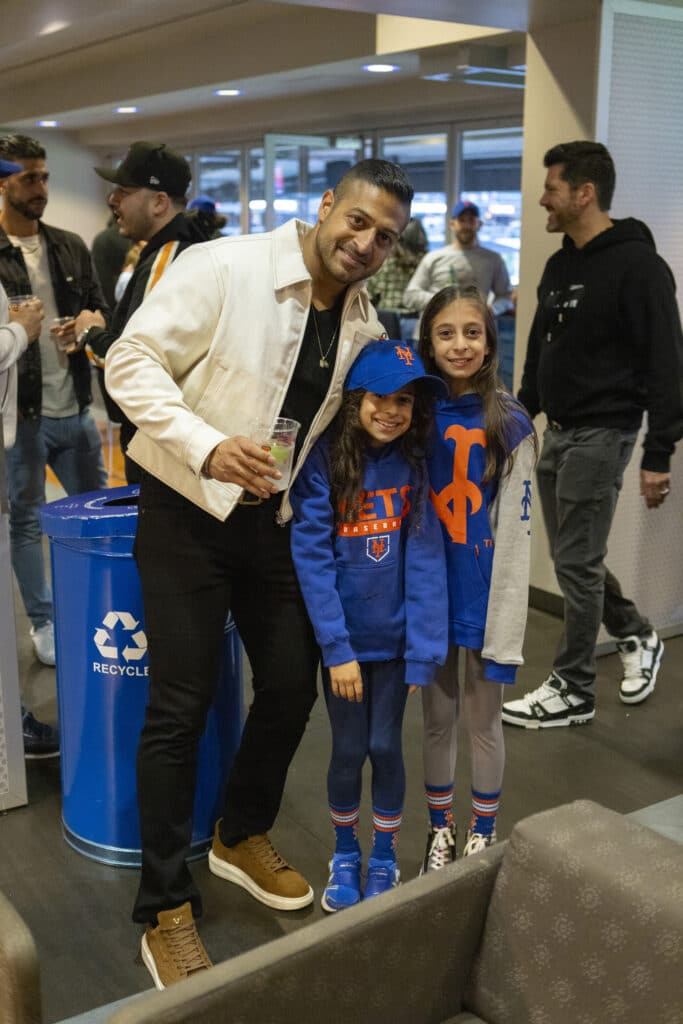 Sameer Chopra posed with daughters in New York Mets gear at baseball game