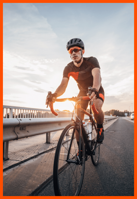 This image shows a cyclist is riding a bicycle on a road.