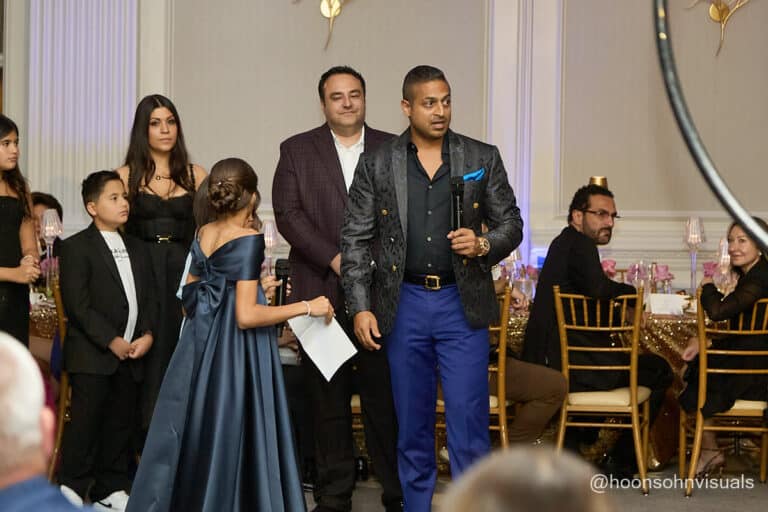 Sameer and Alex with family accepting award and speech