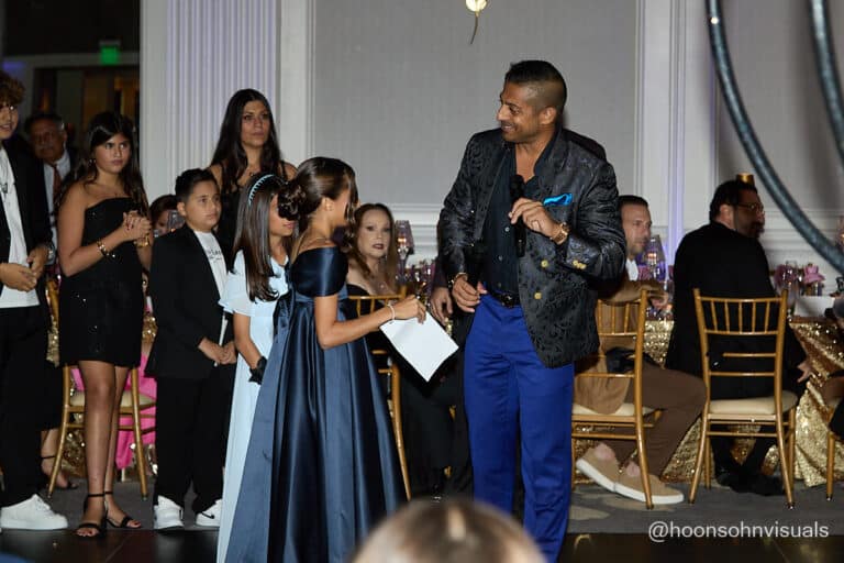 Sameer and Alex with family accepting award and speech
