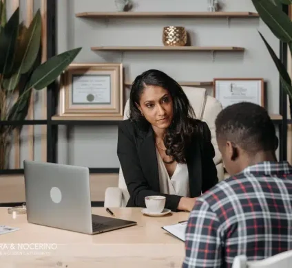 Personal injury lawyer speaking with a client