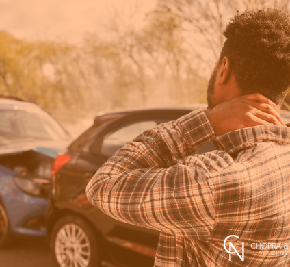 man holding his neck after being in an accident in New York