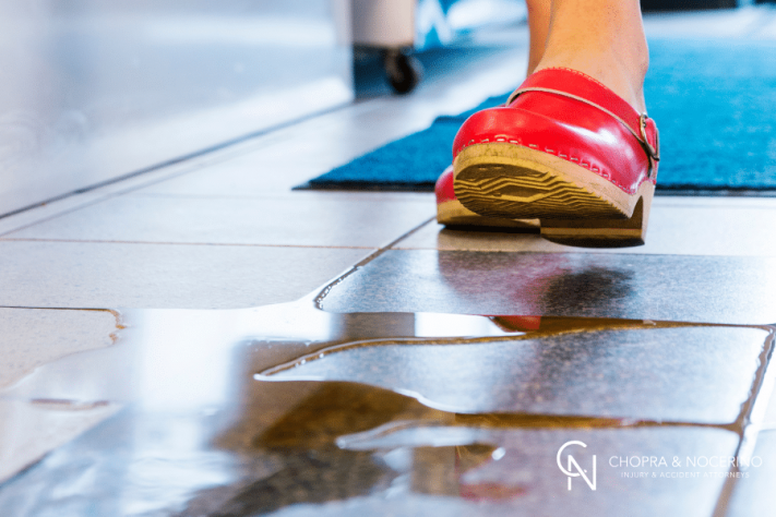 a woman about to slip and fall in a store